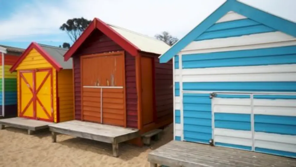 Brighton Beach – Classic Sunrise with Colourful Bathing Boxes